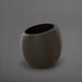 Spiral Globe Fiberglass Planter in matte gunmetal against gray background.