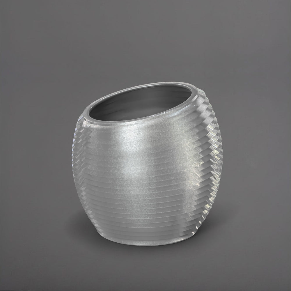 Spiral Globe Fiberglass Planter in metallic silver against gray background.