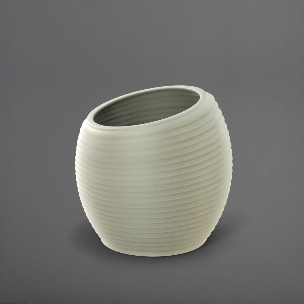 Spiral Globe Fiberglass Planter in satin beige against gray background.
