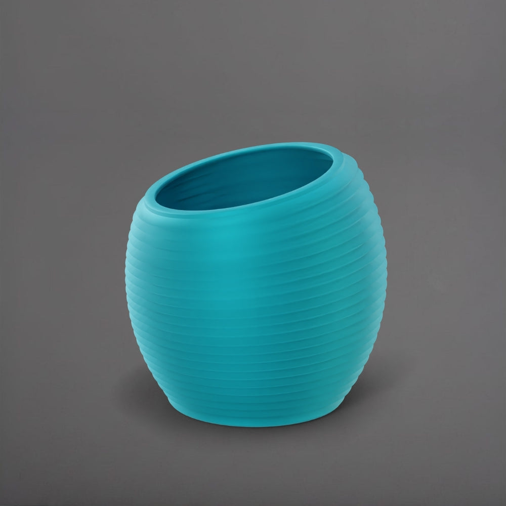 Spiral Globe Fiberglass Planter in satin seafoam green against gray background.