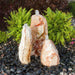 Sunset Chiseled Fountain on black pebbles in action