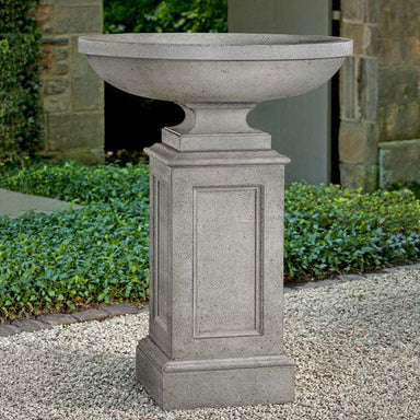 Sutton Urn Planter with Estate Pedestal on gravel in the backyard