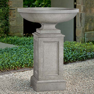 Sutton Urn with Estate Pedestal on gravel in the backyard