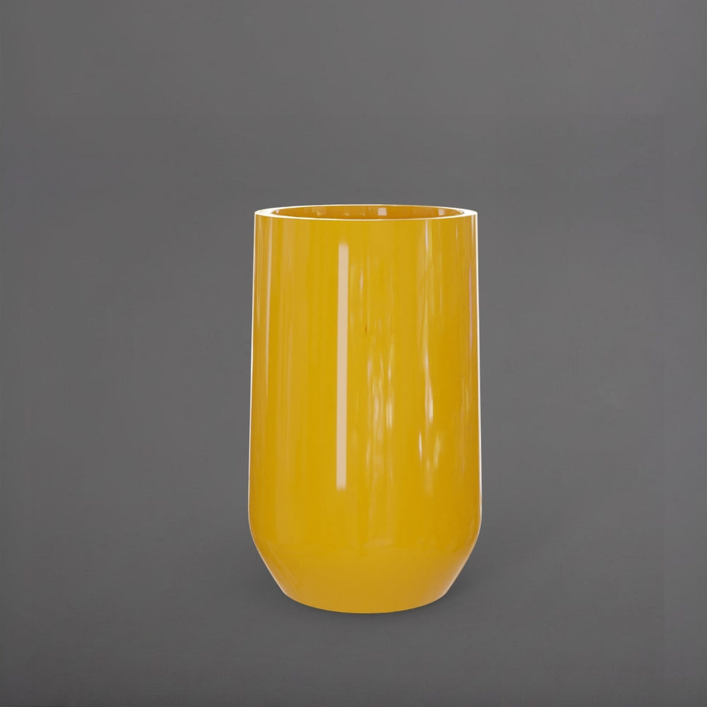 Tall Hayden Tapered Round Fiberglass Planter in gloss saffron against gray background.
