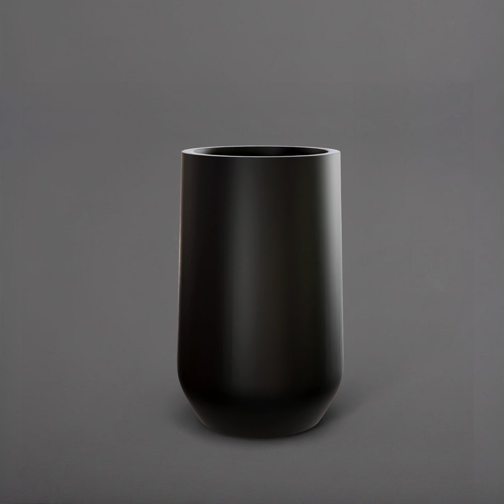 Tall Hayden Tapered Round Fiberglass Planter in matte black against gray background.
