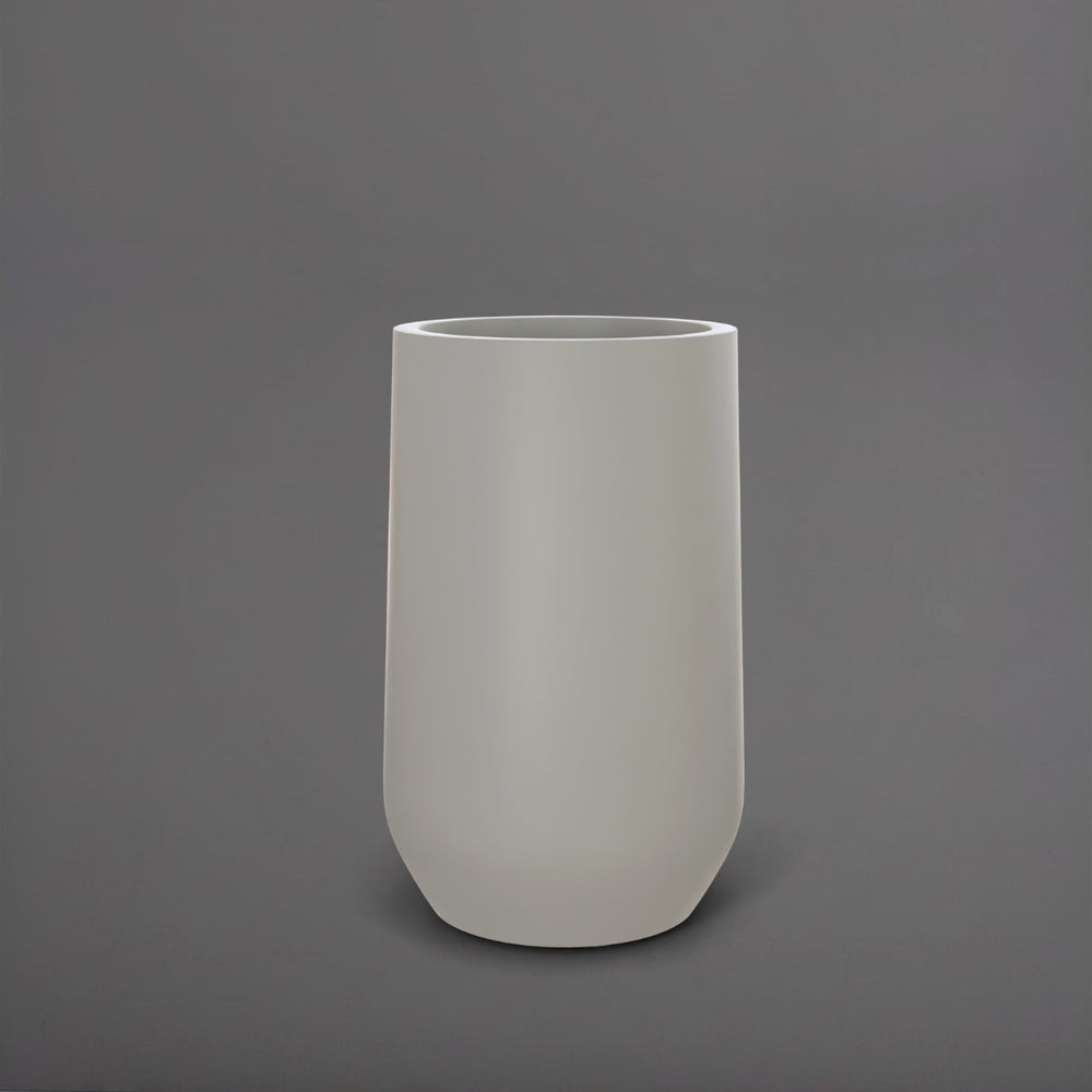 Tall Hayden Tapered Round Fiberglass Planter in matte cement grey against gray background.