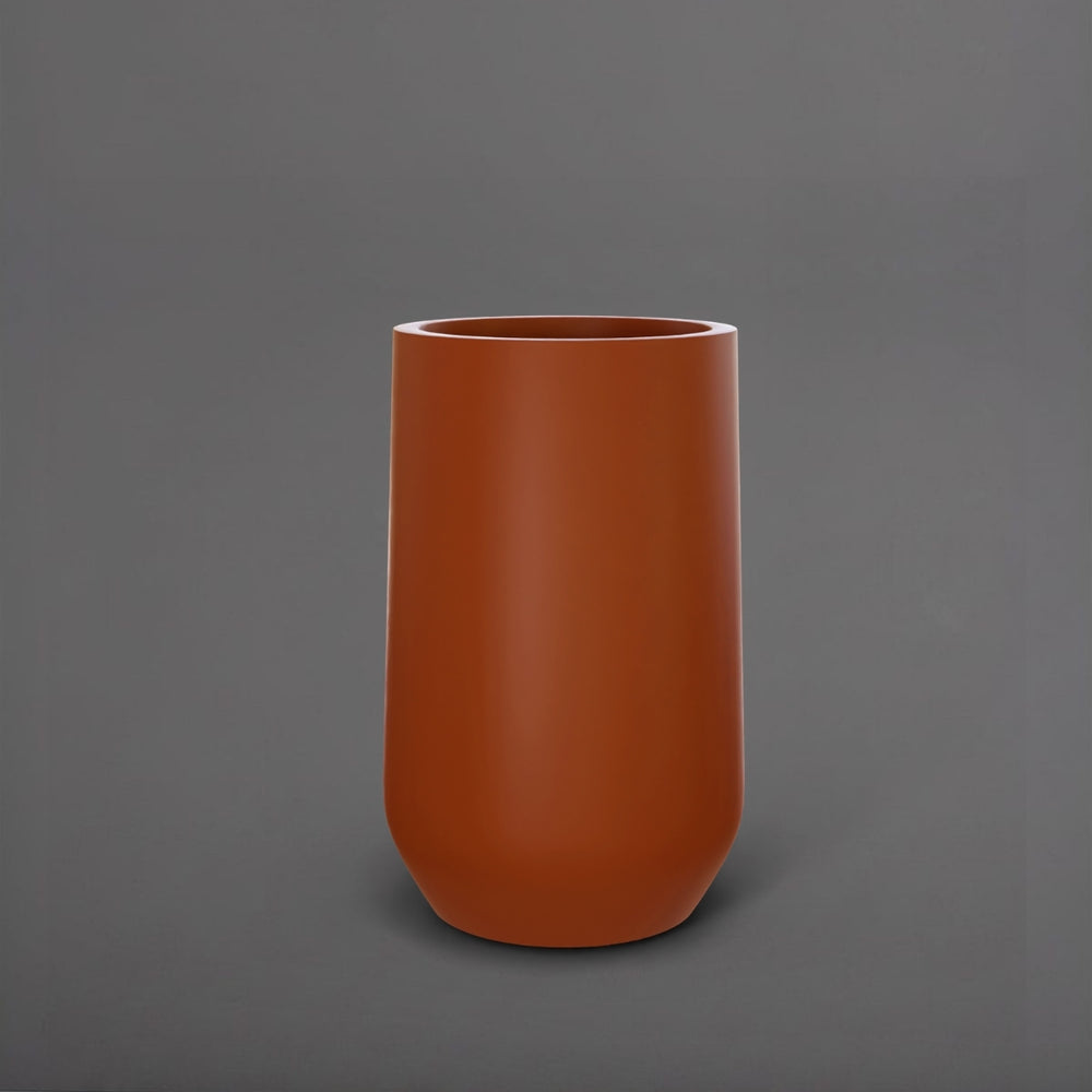 Tall Hayden Tapered Round Fiberglass Planter in matte terra cotta against gray background.