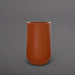 Tall Hayden Tapered Round Fiberglass Planter in matte terra cotta against gray background.