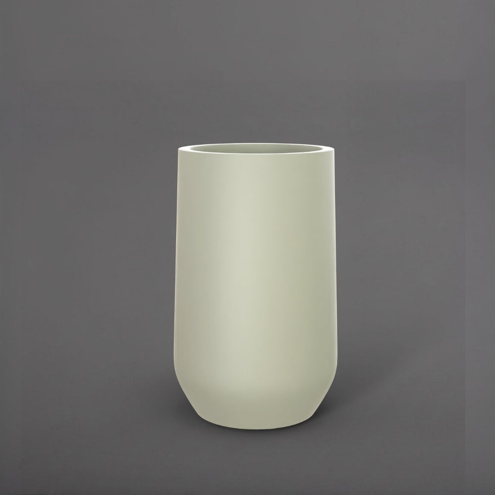 Tall Hayden Tapered Round Fiberglass Planter in satin beige against gray background.