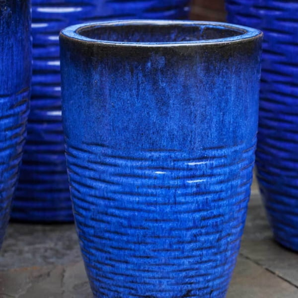 Tall Hyphen Planter - Riviera Blue - S/4 on concrete patio up close.