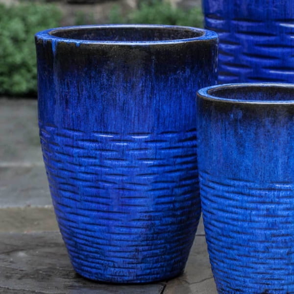 Tall Hyphen Planter - Riviera Blue - S/4 on concrete patio.