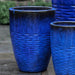 Tall Hyphen Planter - Riviera Blue - S/4 on concrete patio.