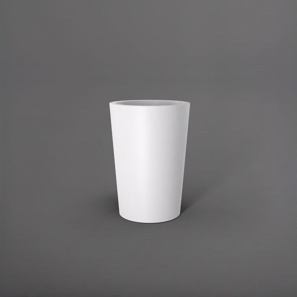 Tagel Tapered Round Fiberglass Planter in matte bright white against gray background.