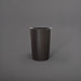 Tagel Tapered Round Fiberglass Planter in matte charcoal against gray background.