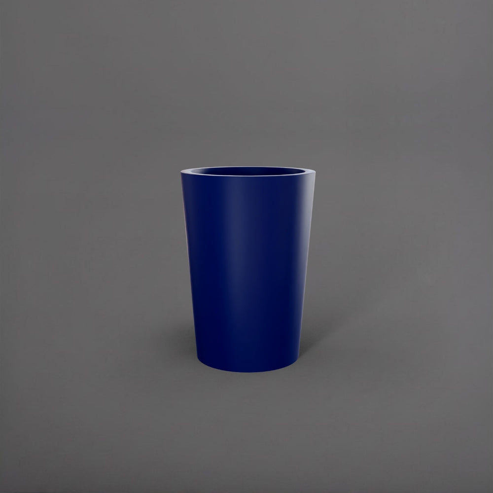 Tagel Tapered Round Fiberglass Planter in matte cobalt blue against gray background.