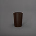 Tagel Tapered Round Fiberglass Planter in matte dark brown against gray background.