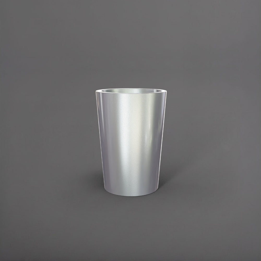 Tagel Tapered Round Fiberglass Planter in metallic silver against gray background.