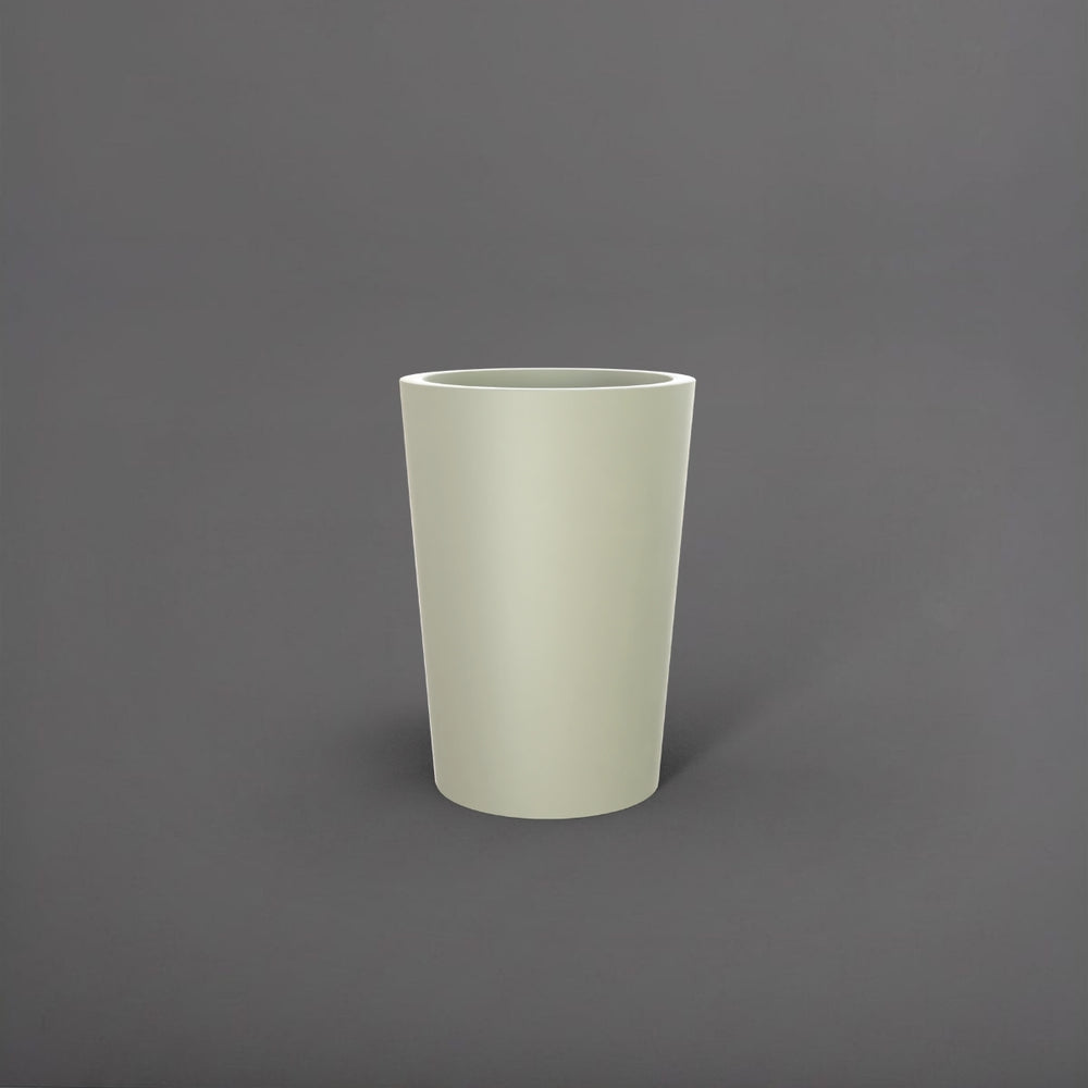 Tagel Tapered Round Fiberglass Planter in satin beige against gray background.