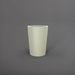 Tagel Tapered Round Fiberglass Planter in satin beige against gray background.