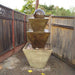 Three Tier with Ball in action beside fence.