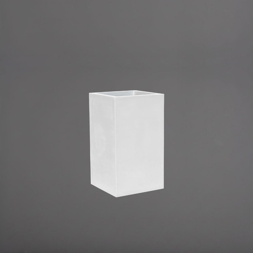 Tolga Corner Fiberglass Planter in gloss bright white against gray background.