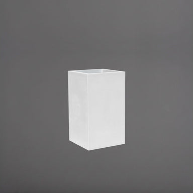 Tolga Corner Fiberglass Planter in gloss bright white against gray background.