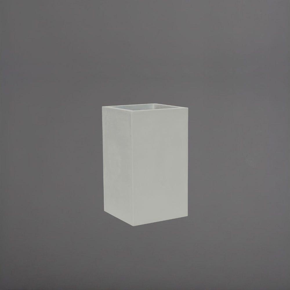 Tolga Corner Fiberglass Planter in matte cement grey against gray background