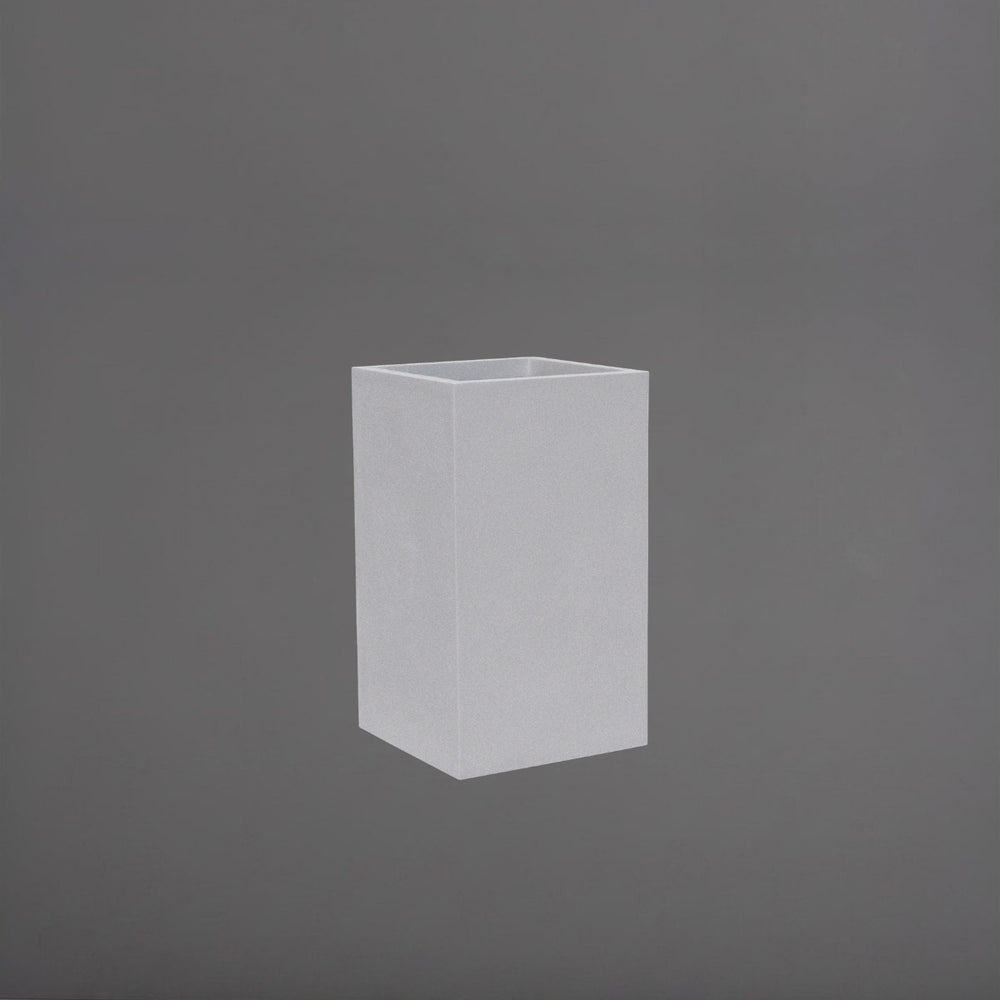 Tolga Corner Fiberglass Planter in metallic silver against gray background.