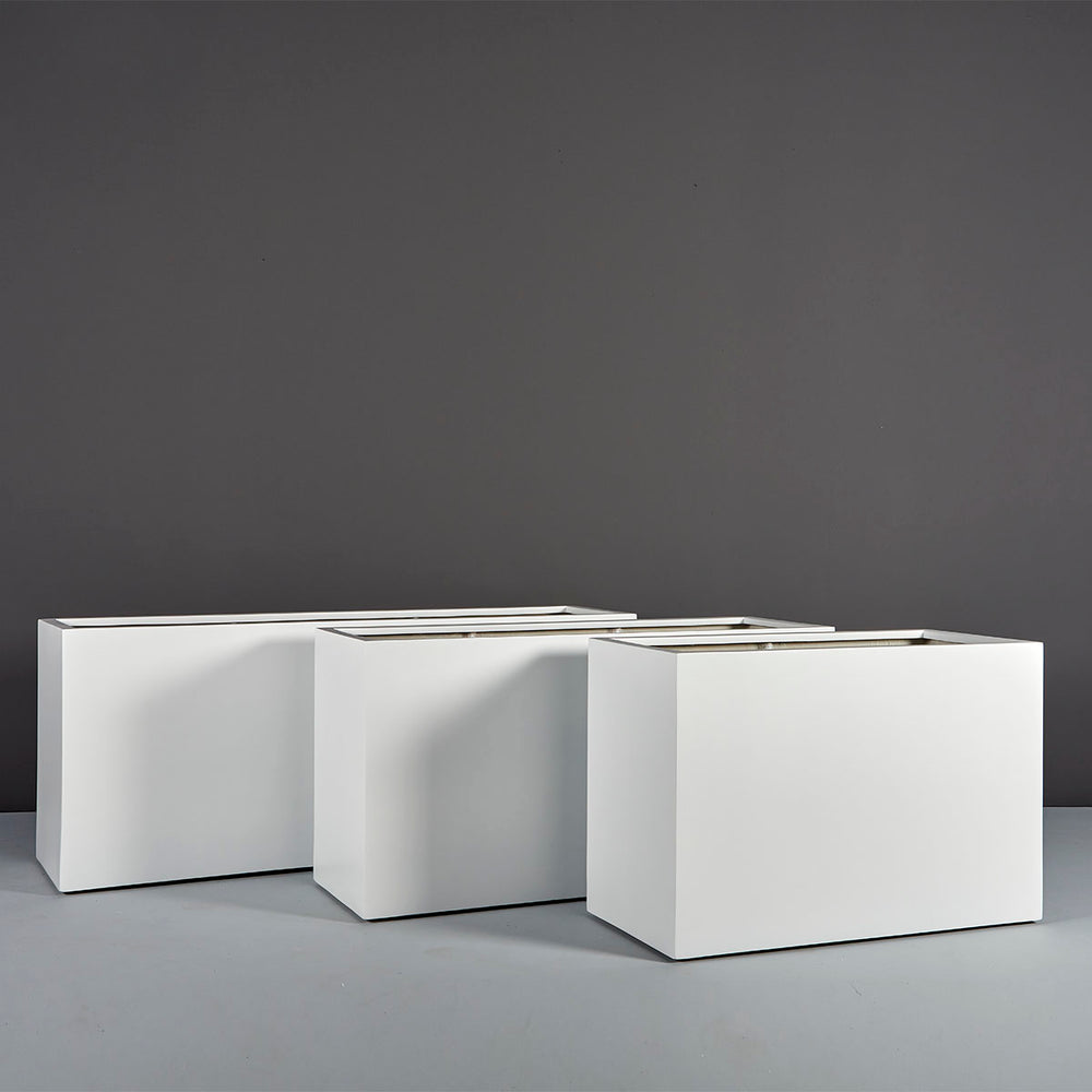 Tolga Rectangle Fiberglass Planter on concrete shown with different sizes