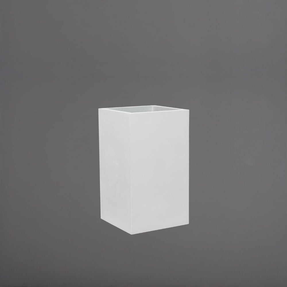 Torino Corner Fiberglass Planter in gloss bright white against gray background.