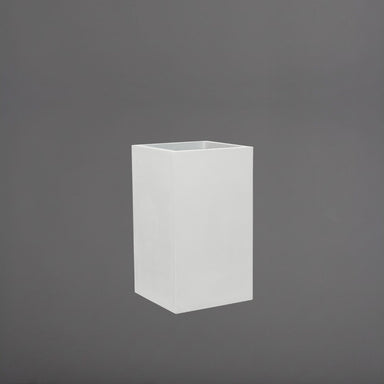 Torino Corner Fiberglass Planter in gloss bright white against gray background.