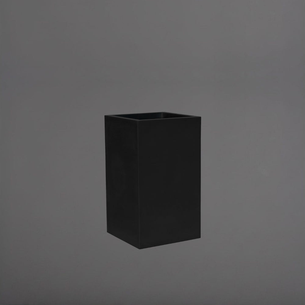Torino Corner Fiberglass Planter in matte black against gray background.
