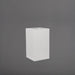 Torino Corner Fiberglass Planter in matte bright white against gray background.