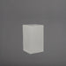 Torino Corner Fiberglass Planter in matte cement grey against gray background.
