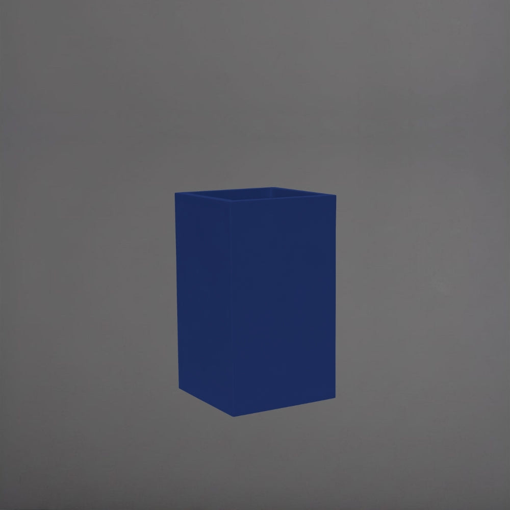 Torino Corner Fiberglass Planter in matte cobalt blue against gray background.