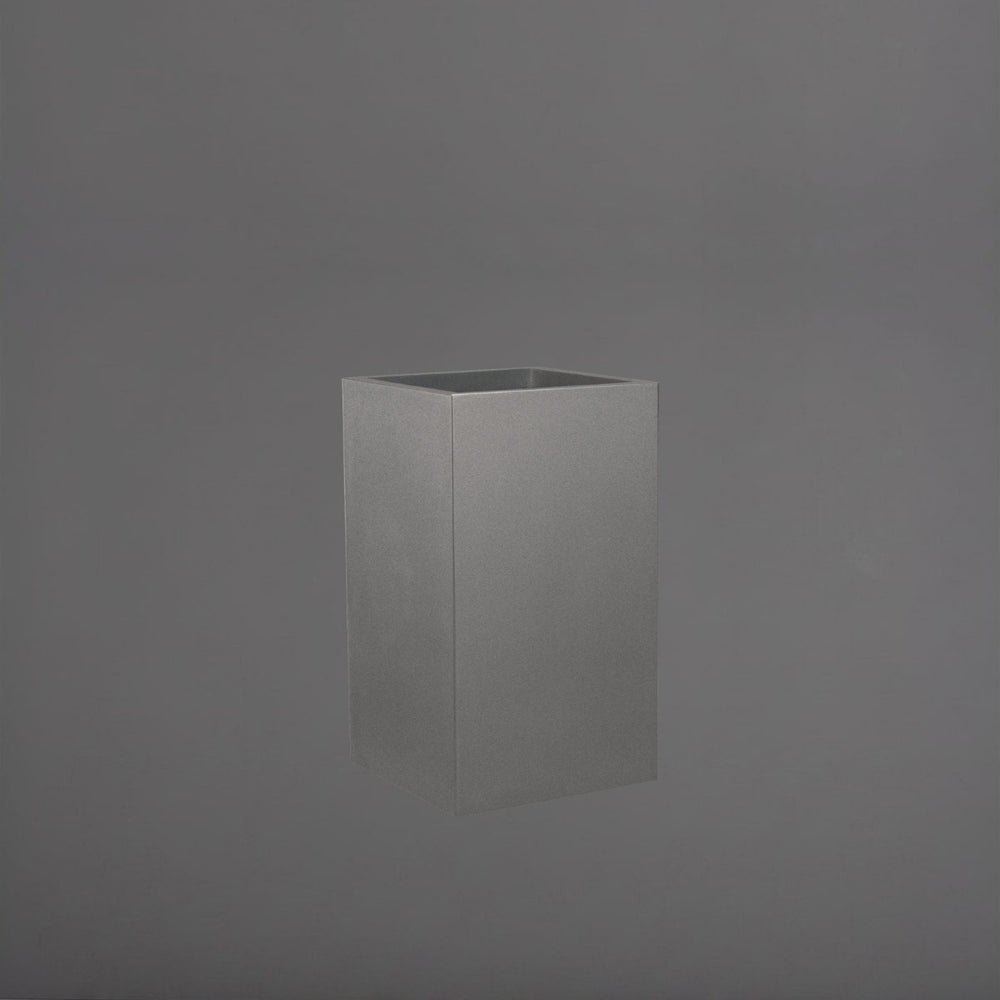Torino Corner Fiberglass Planter in matte gunmetal against gray background.