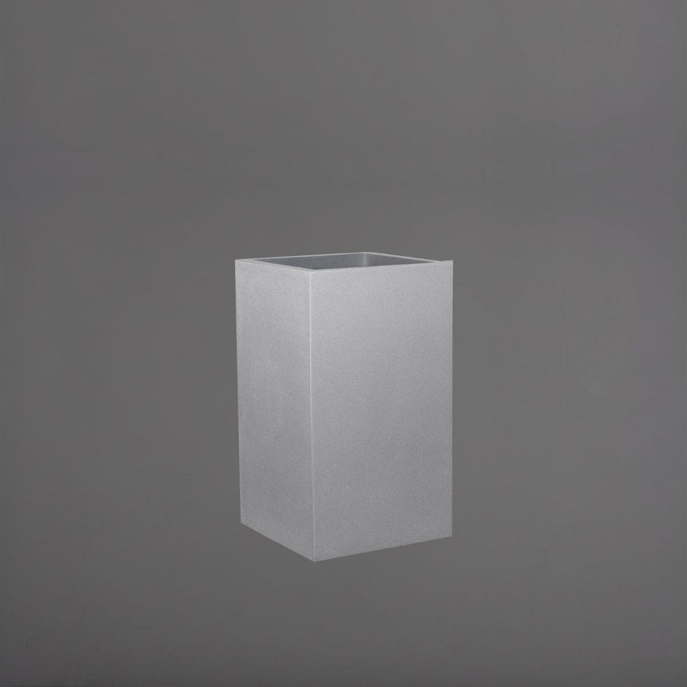 Torino Corner Fiberglass Planter in metallic silver against gray background.