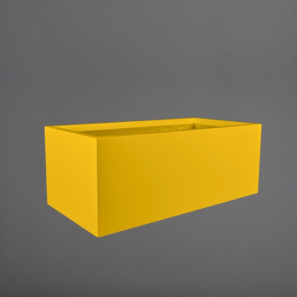 Torino Wide Rectangle Fiberglass Planter in gloss saffron against gray background.