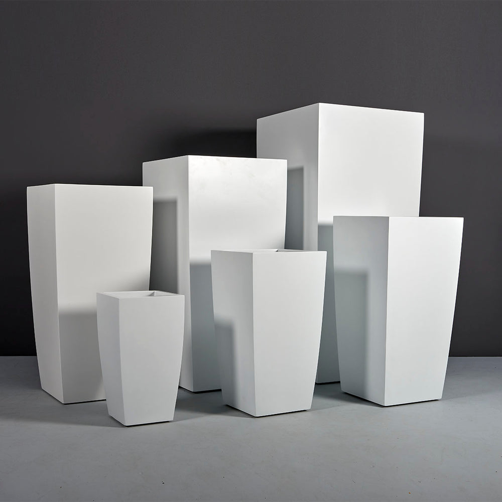 Toulan Tall Tapered Square Fiberglass Planter on concrete shown with different sizes.