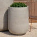 Tribeca Tall Planter, 30 inch on gravel filled with plants.
