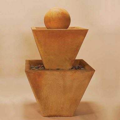 Two Tier Fountain with Ball against brown background.