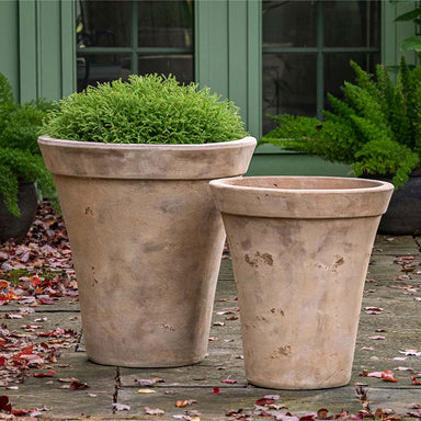 Usuki Planter - Antico Terra Cotta - S/2 on concrete filled with plants