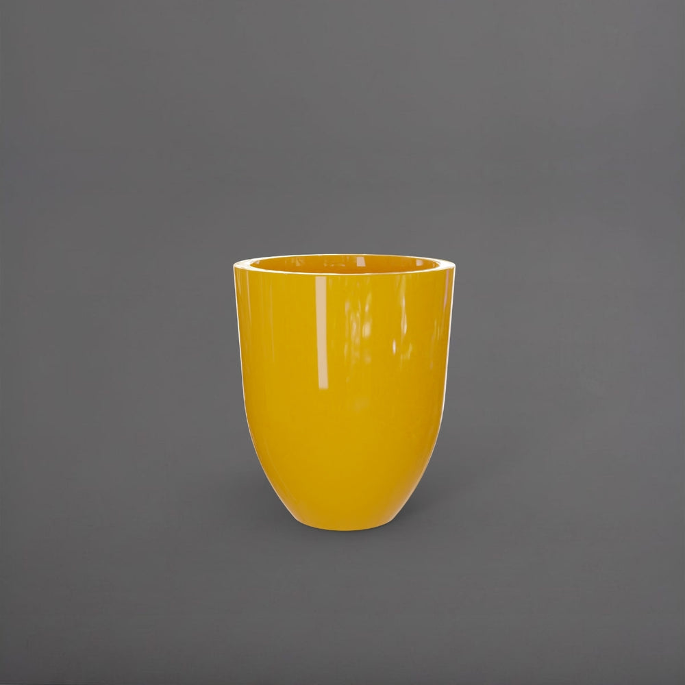 Valencia Tapered Round Fiberglass Planter in gloss saffron against gray background.