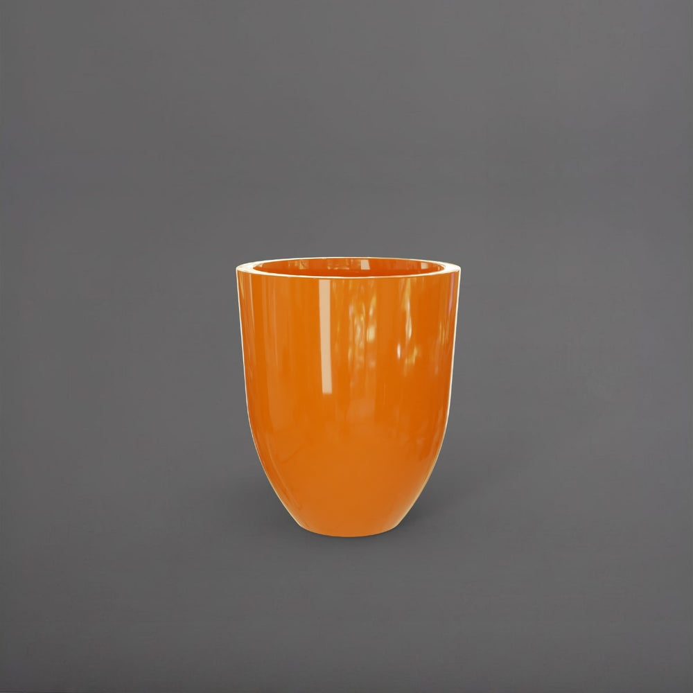 Valencia Tapered Round Fiberglass Planter in gloss tangerine against gray background.