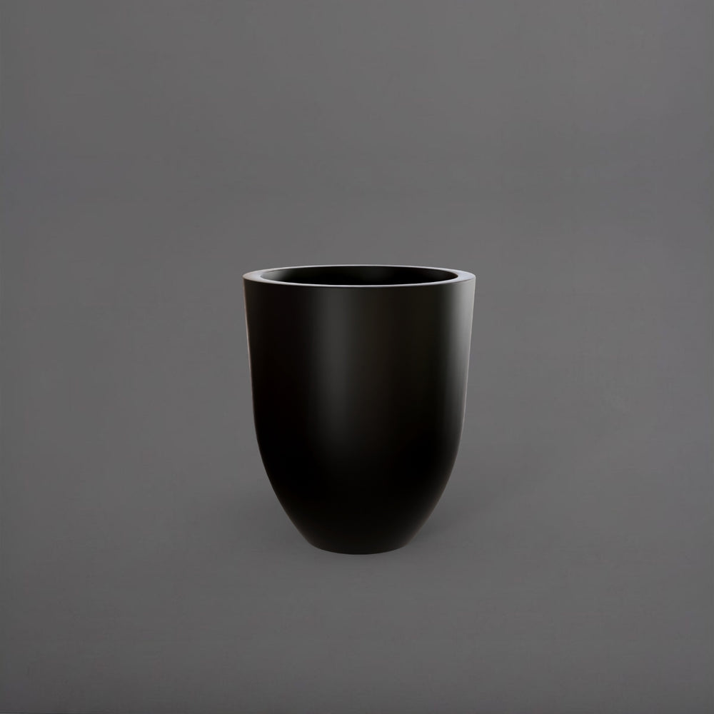 Valencia Tapered Round Fiberglass Planter in matte black against gray background.