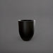 Valencia Tapered Round Fiberglass Planter in matte black against gray background.