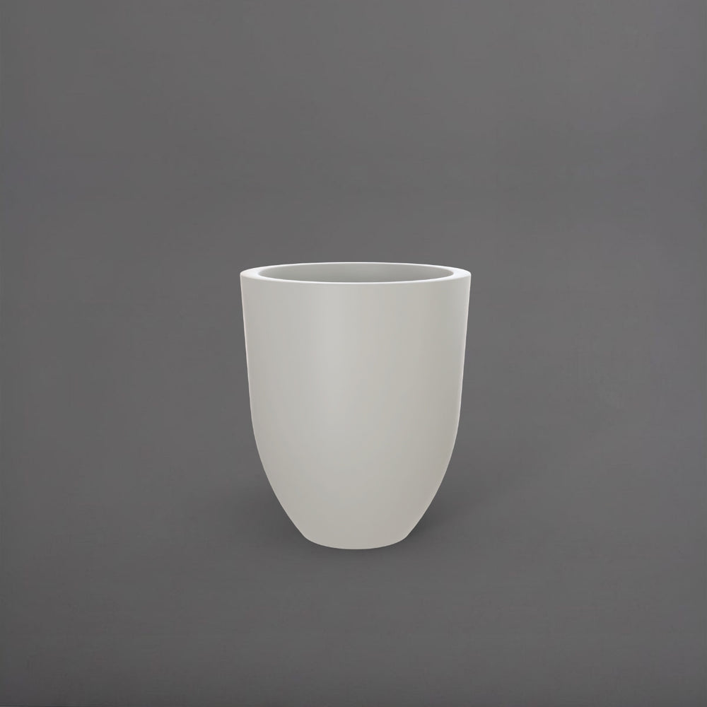 Valencia Tapered Round Fiberglass Planter in matte cement grey against gray background.
