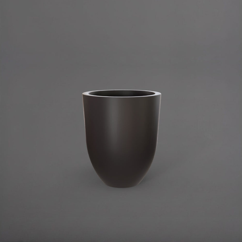 Valencia Tapered Round Fiberglass Planter in matte charcoal against gray background.