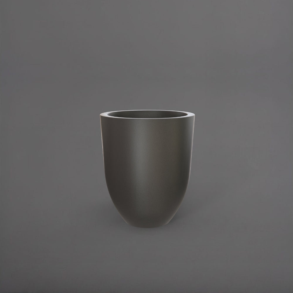 Valencia Tapered Round Fiberglass Planter in matte gunmetal against gray background.