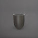 Valencia Tapered Round Fiberglass Planter in matte gunmetal against gray background.